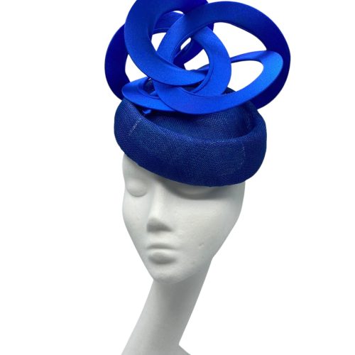 Blue headpiece with blue swirl detail.